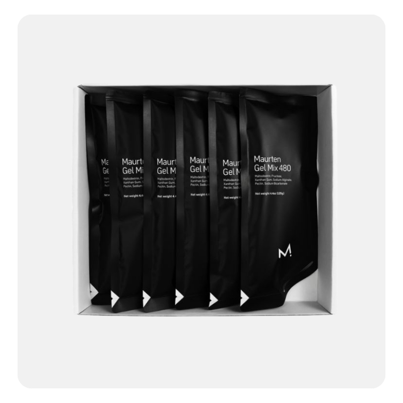 Box of six black Maurten Gel Mix 480 energy gel pouches neatly arranged in white packaging