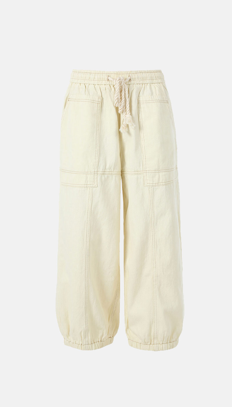 Cream wide-leg cotton trousers with elasticated drawstring waist, large front patch pockets and elasticated hems