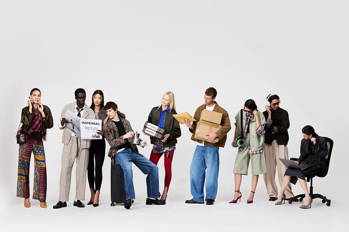 Diverse group of models in modern fashion holding parcels, newspapers, laptop, headphones and suitcase on white background
