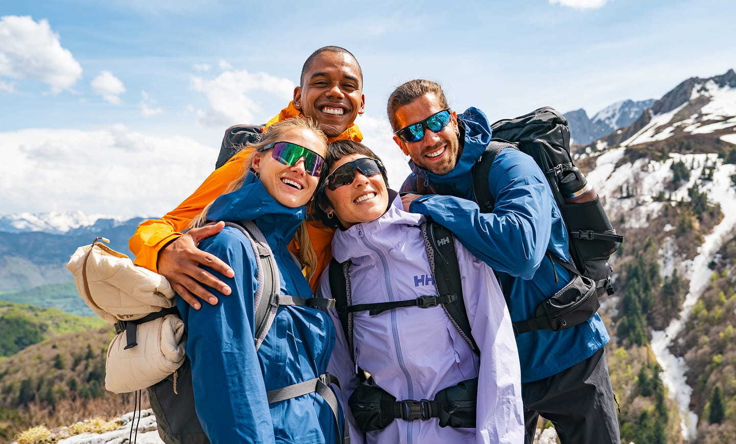 People hiking in the mountains, wearing Helly Hansen