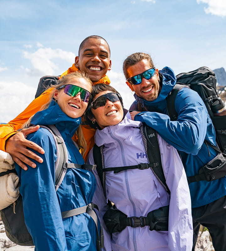 People hiking in the mountains, wearing Helly Hansen