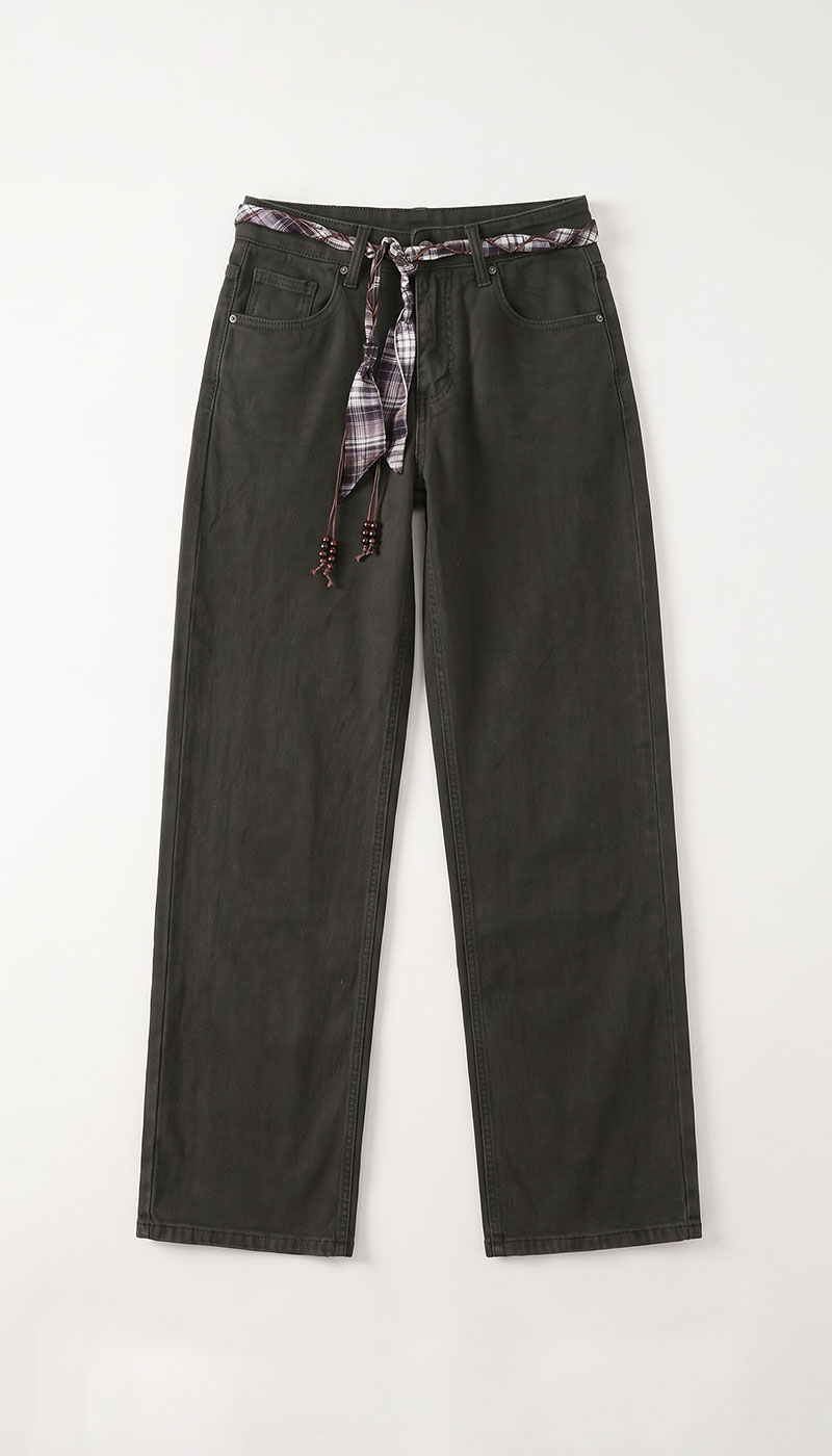 Dark grey straight-leg jeans with a tied plaid fabric belt and beaded tassels, flat-lay on white background