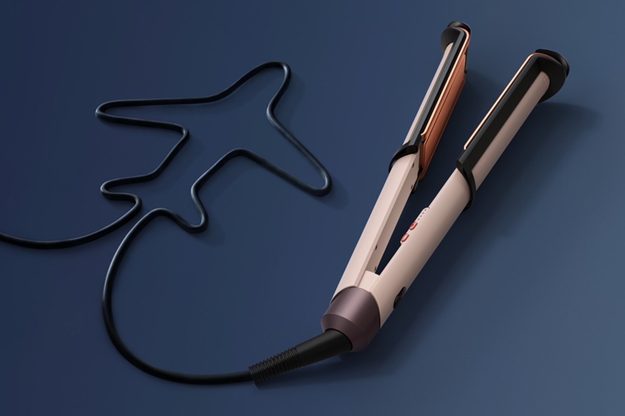 Piastra per capelli Dyson Corrale CoolShine con cavo a forma di aeroplano.