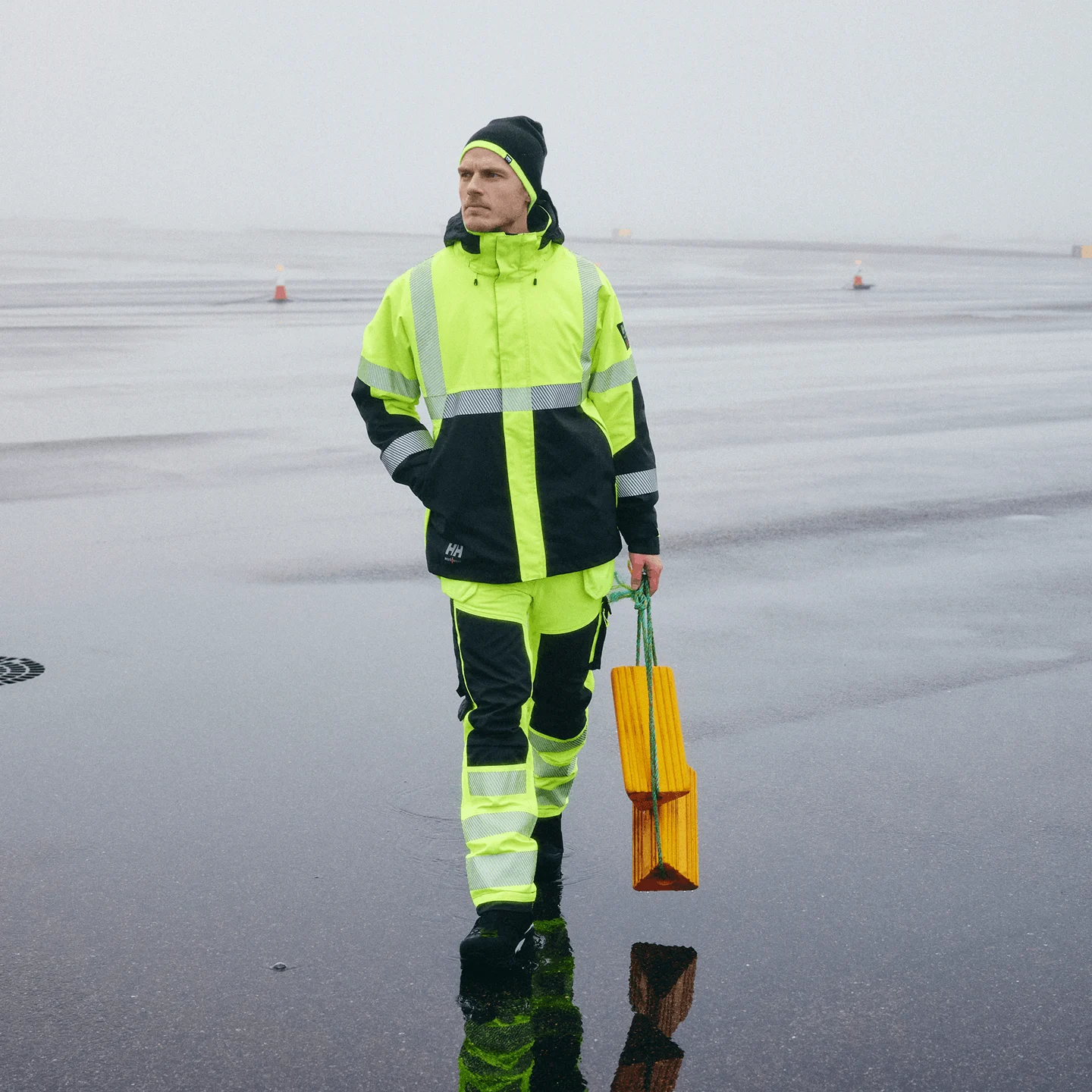 Man wearing Helly Hansen Hi Vis Waterproof Shell Jacket