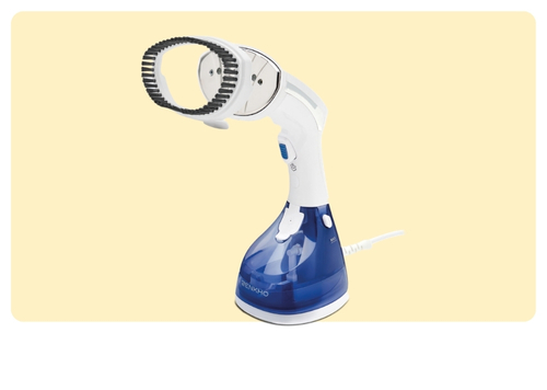 Handheld blue and white garment steamer with detachable brush head and power cord on cream background