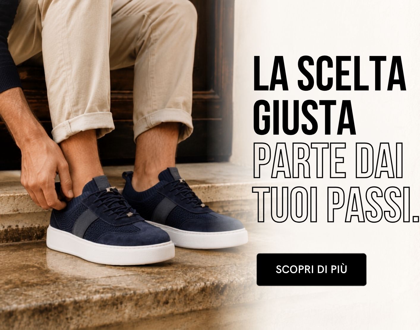 Person sitting on stone steps tying navy sneakers with white soles next to Italian ad text 'La scelta giusta parte dai tuoi passi'