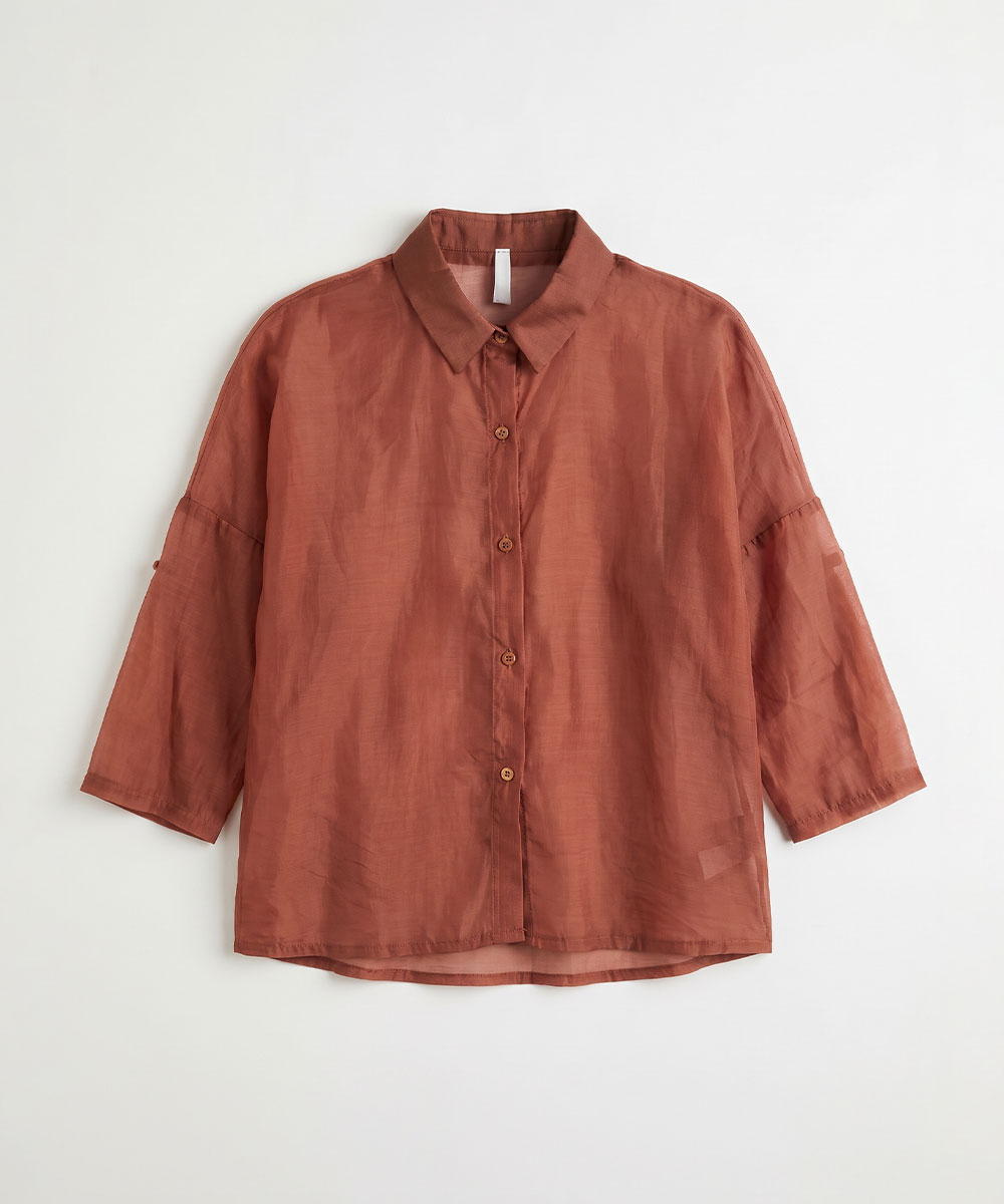 Rust-coloured lightweight button-up blouse for women, 3/4 sleeves, relaxed fit with spread collar; flat-lay on white background