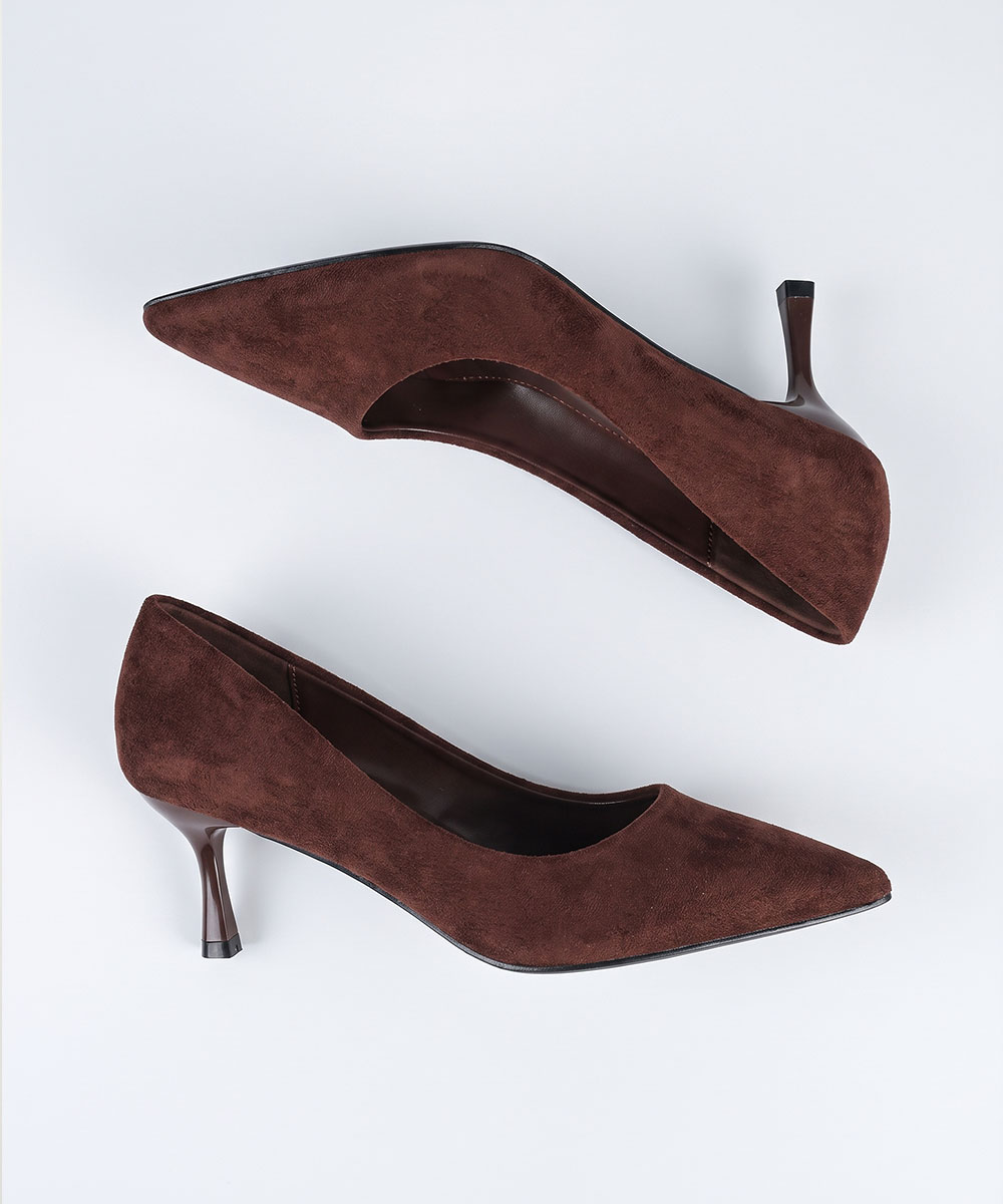Pair of brown suede pointed-toe kitten heel shoes on white background, women's low stiletto pumps, elegant office footwear