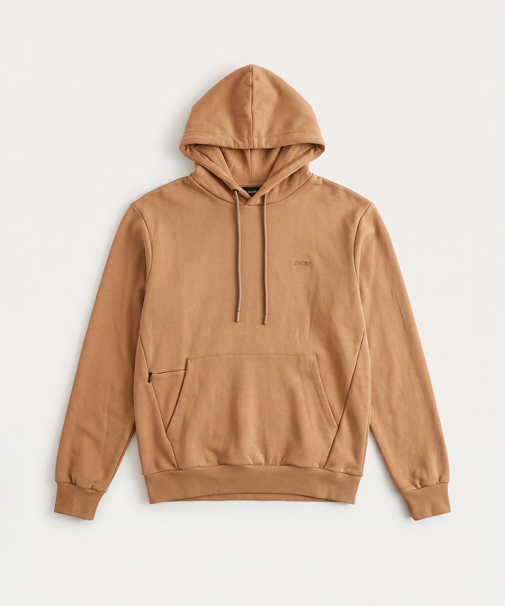 Camel-coloured pullover hoodie flat-lay with drawstrings, kangaroo pocket with small zip, ribbed cuffs and hem on plain background