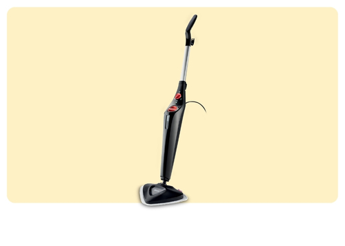 Black upright steam mop with triangular cleaning head and long handle, standing on pale cream background
