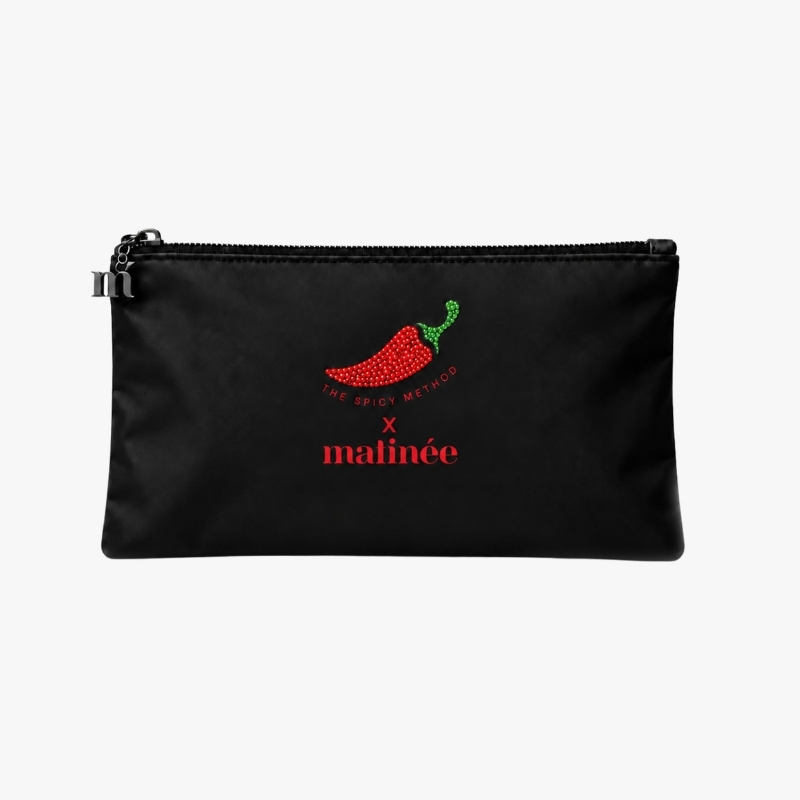 Black zip cosmetic pouch featuring a red jeweled chilli logo, red "matinée" branding and metal zipper charm