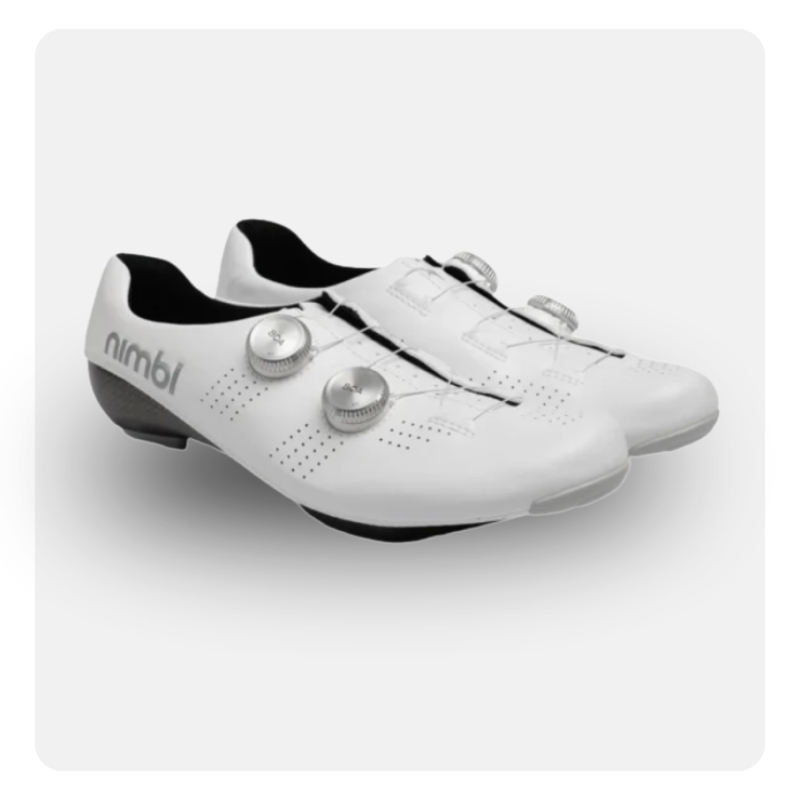 Pair of white road cycling shoes with dual dial closure system, perforated upper, black heel accents and removable cleats
