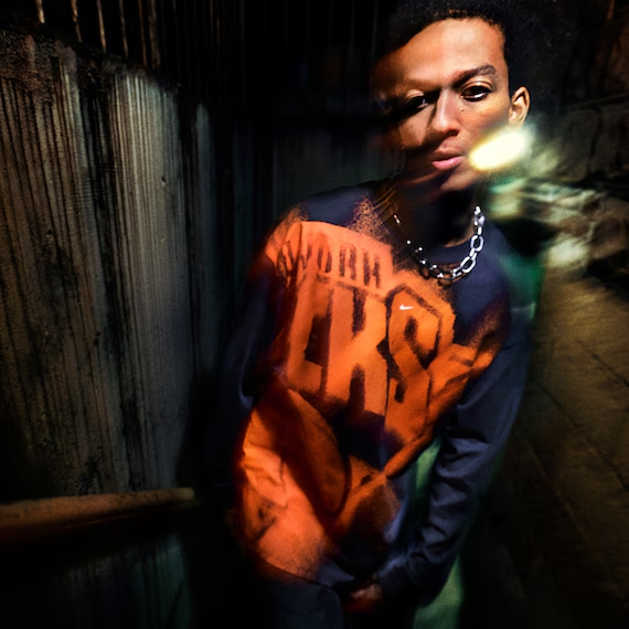 Model wears Knicks long sleeve t-shirt