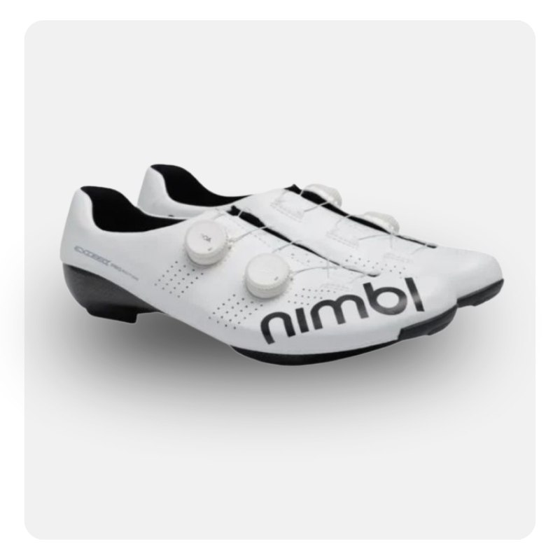 Pair of white Nimbl road cycling shoes with dual dial closures, black soles and perforated upper