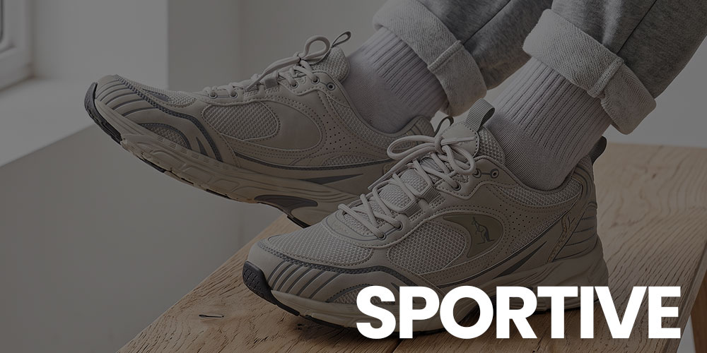 Close-up of grey athletic trainers on a wooden bench, person wearing white socks and rolled grey joggers with 'SPORTIVE' text overlay