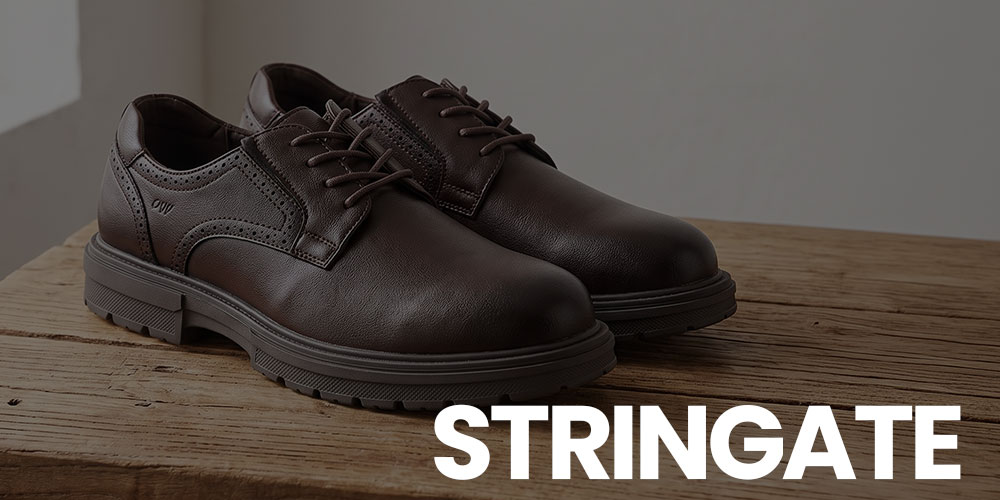 Pair of dark brown leather men's derby shoes with chunky rubber soles on a rustic wooden table, large 'STRINGATE' logo visible