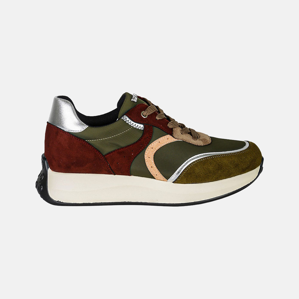 Side view of a multicoloured suede-and-leather trainer in olive green, rust and brown with silver accents and chunky cream sole