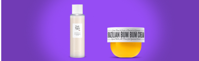 Prodotti per la cura della pelle su sfondo viola: Beauty of Joseon Ginseng Essence Water e Sol de Janeiro Brazilian Bum Bum Cream.