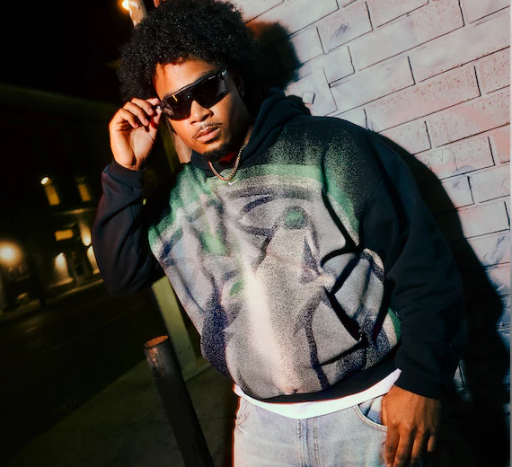 Model wears Timberwolves Nike Standard Issue Hoodie