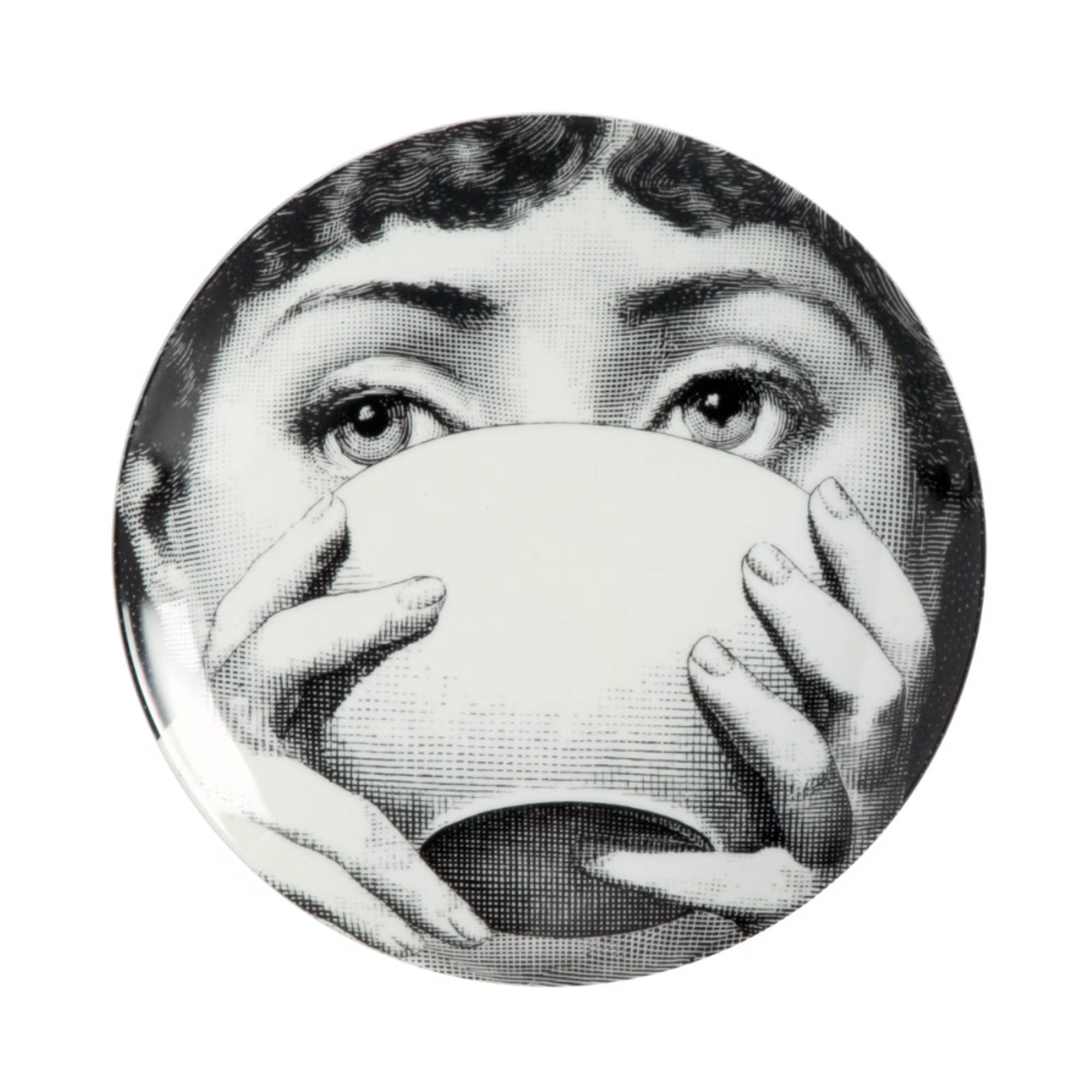 Round decorative ceramic plate featuring a vintage black-and-white illustration of a woman's eyes peeking over a teacup as hands hold the cup