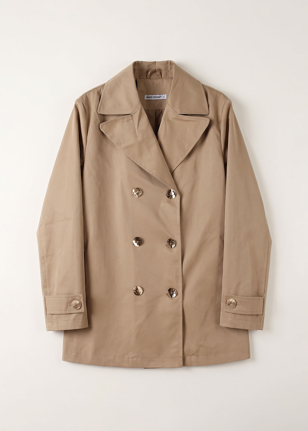 Beige double-breasted short trench coat with wide lapels and six glossy buttons, laid flat on a white background