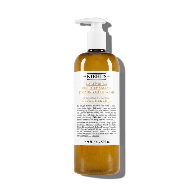 Vasetto aperto di Kiehl's Ultra Facial Cream con texture bianca visibile su sfondo bianco