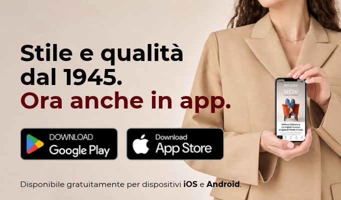 Woman in blazer holding phone showing fashion app; text 'Style and quality since 1945 — now in app' with App Store and Google Play badges
