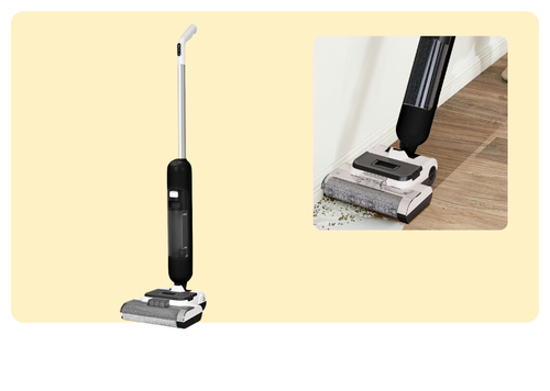 Electric cordless floor mop with motorised roller head cleaning dust and debris from a hardwood floor near the skirting board