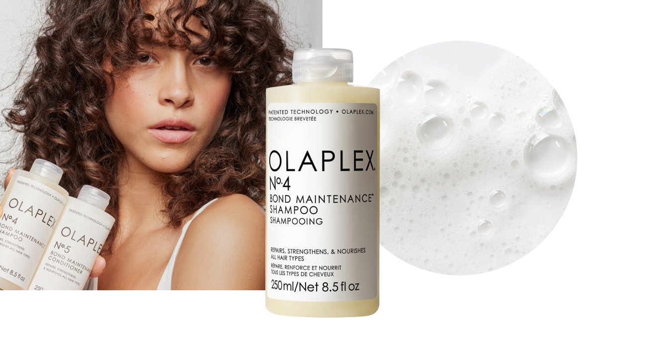 Flaconi di Olaplex No. 4 Shampoo e No. 5 Conditioner davanti a una donna dai capelli ricci e una texture schiumosa.