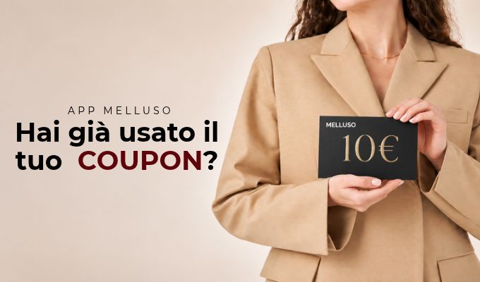 Woman in beige blazer holding a black Melluso 10€ coupon card with Italian text asking "Hai già usato il tuo COUPON?"