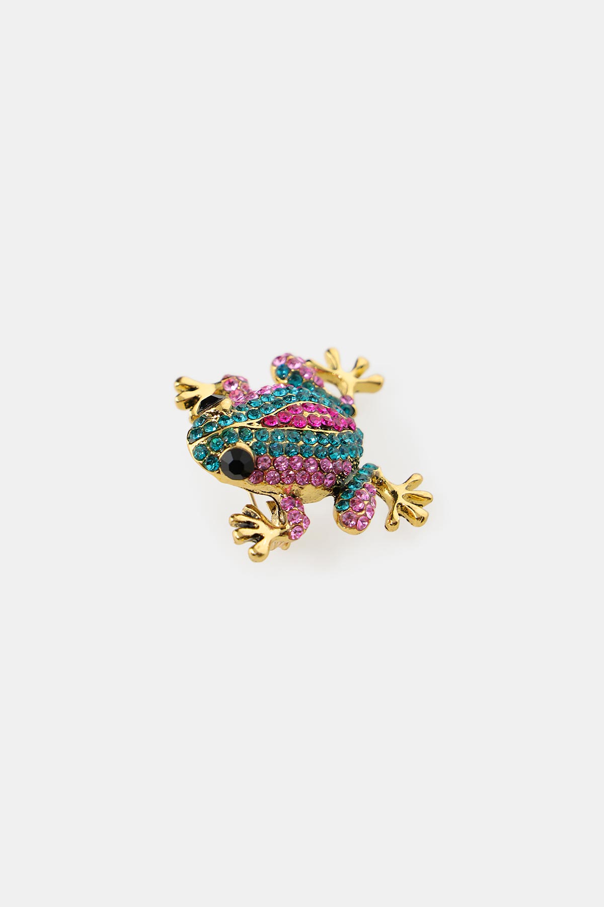 Gold-tone frog brooch encrusted with pink and teal crystals with black eyes on a white background