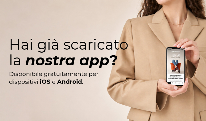 Person in beige blazer holding a smartphone displaying a shoe app, beside Italian text asking to download the app for iOS and Android
