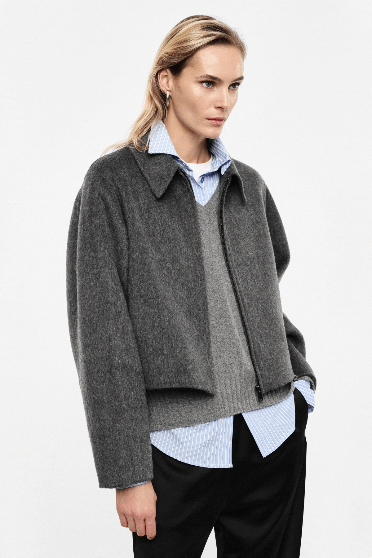 Grid of a female model showing three outfits: grey cropped jacket over striped shirt; red cropped sweater with long grey skirt (rear view); black sweater over shirt with leather skirt