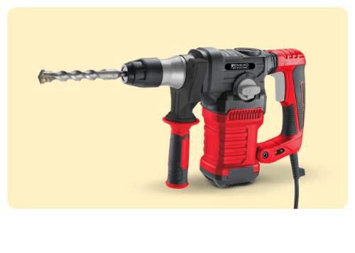 Corded red and black rotary hammer drill with side handle and SDS masonry bit on pale background