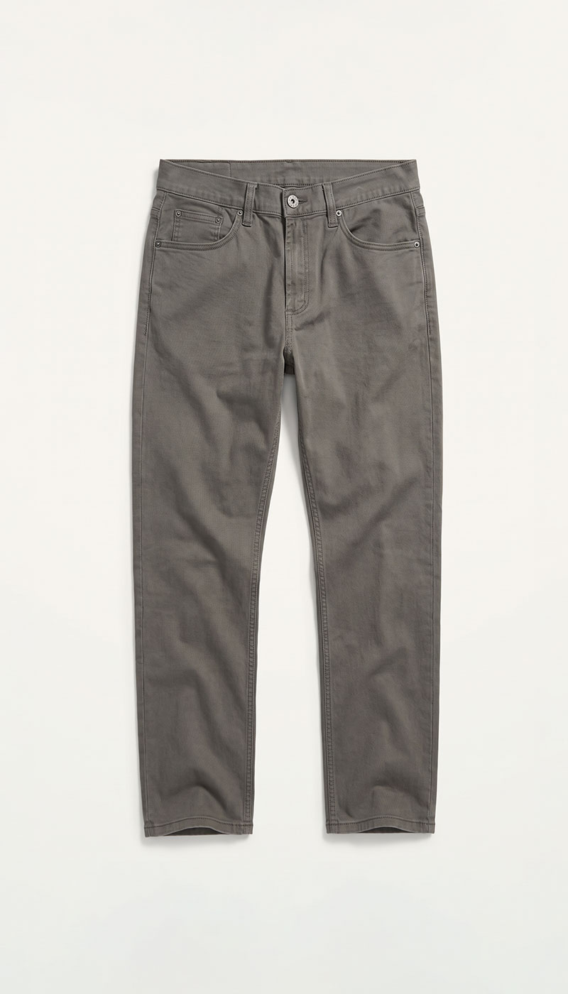 Flat-lay grey slim-fit jeans with five-pocket design on white background