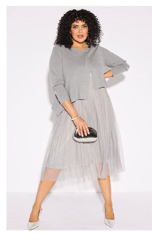 Pullover elegante con pietre decorative e orlo a punta