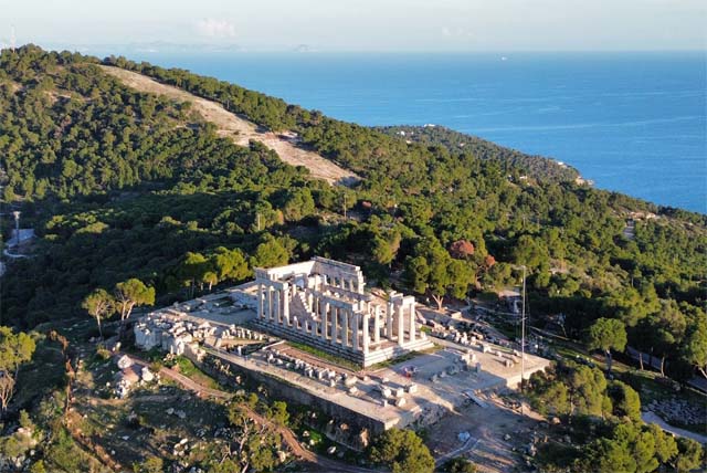 Ancient Greek temple with stone columns.
