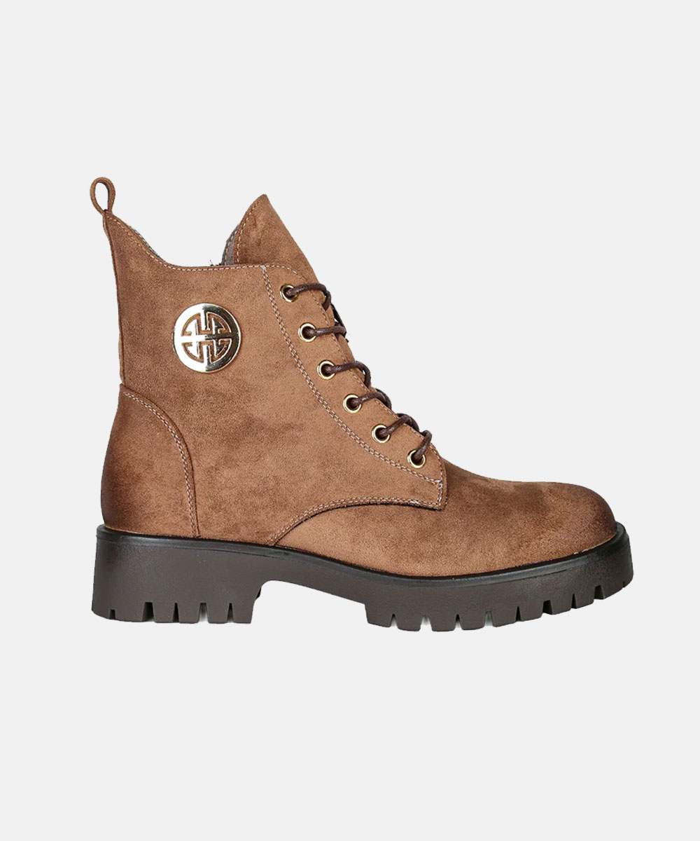 Brown suede lace-up ankle combat boot with chunky lug sole and gold logo medallion, side view