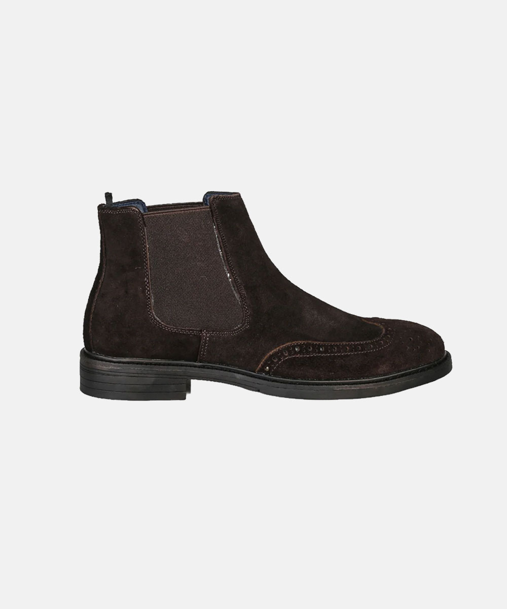 Dark brown suede brogue Chelsea boot, side view showing elastic gusset, wingtip perforations and stacked low heel