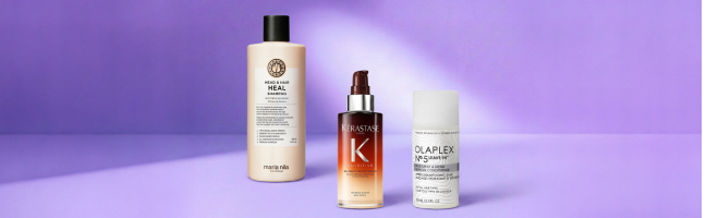 Prodotti per la cura dei capelli con shampoo, olio per capelli e trattamento leave-in su uno sfondo viola, prodotti per capelli curati.