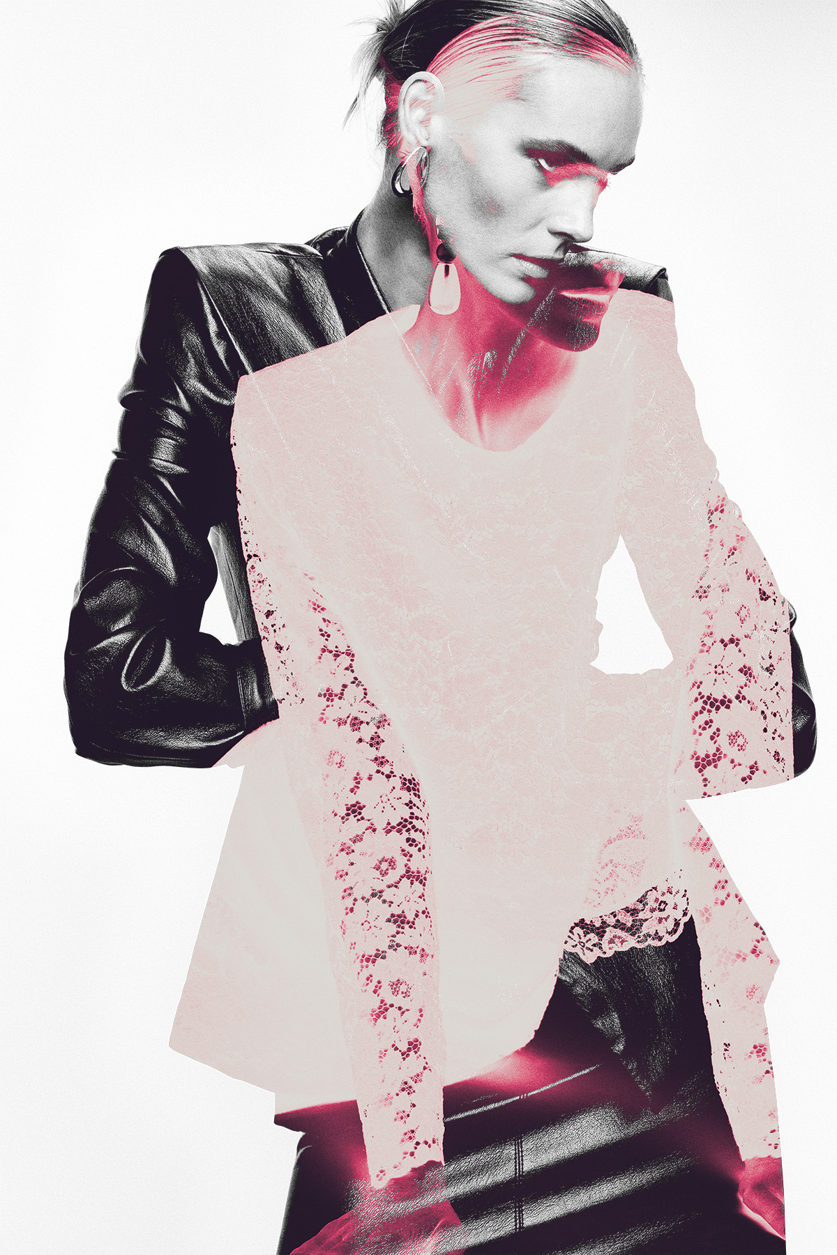 Editorial double-exposure fashion portrait of a model wearing a black leather jacket over a pink lace top with a statement earring