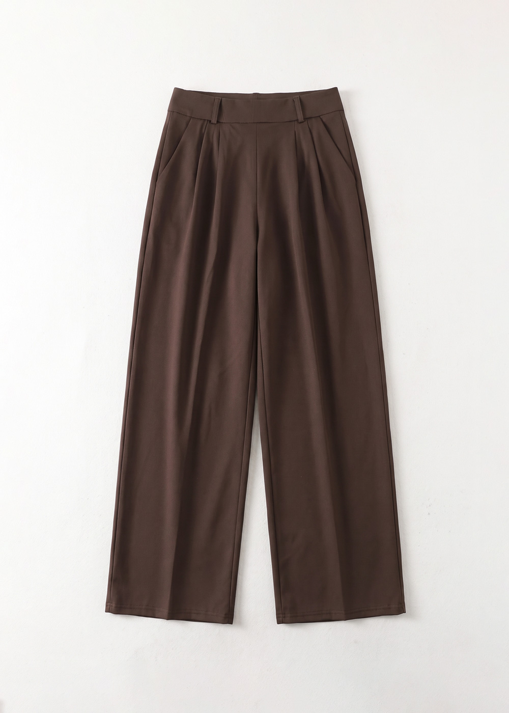Brown wide-leg high-waist women’s trousers with front pleats and belt loops, flat-lay on white background